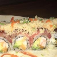 Titanic Roll · Spicy crunchy shrimp and avocado wrapped with tuna yellowtail with chefs special sauce.