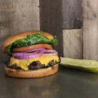 Build Your Own Burger · Build your own burger, served with lettuce, tomato, onion and pickle spear on a bun.