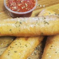 Bosco Sticks (3 Pieces) · Three breadsticks stuffed with mozzarella cheese, drizzled with garlic butter and served wit...