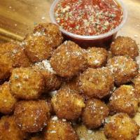 Cheddar Cheese Bites · Breaded cheddar cheese served with marinara.