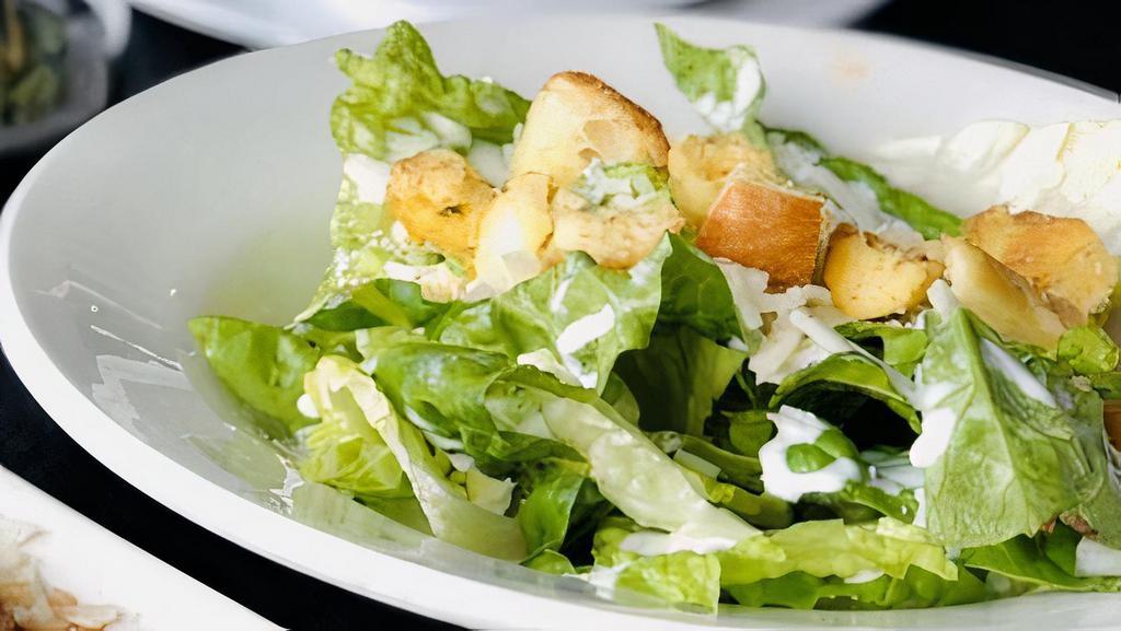 Caesar Salad · Romaine lettuce, Pecorino Romano Cheese Served with Caesar dressing & topped with Home-Made Croutons.