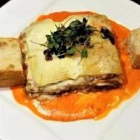 Lasagna · Baked pasta layered with authentic Bolognese Meat Sauce and Mozzarella Cheese.