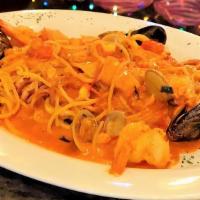 Spaghetti Allo Scoglio · Spaghetti with fresh Clams, Mussels, Calamari, Scallops, Shrimp, Salmon, Olive Oil, White Wi...