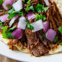 Barbacoa / Stewed Beef Taco · Stewed Beef and wrapped in 2 corn tortillas.