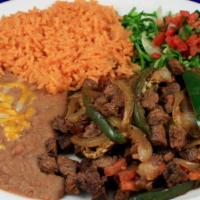 Bistec A La Mexicana Dinner · Mexican-style steak, with rice and beans on the side.