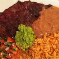 Carne Asada Arrachera · Skirt steak, rice and beans. Comes with corn tortillas.