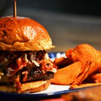 Bad Brads Bbq Burger · Topped with brisket, cheddar cheese, coleslaw, and sweet Bbq sauce.