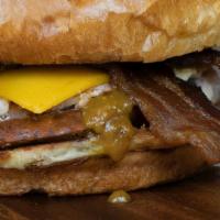 Boss · Pulled chicken, cheddar cheese, house sausage, bacon and sweet mustard bbq sauce.