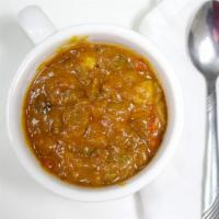 Bbq Chili * · A hearty chili flavored with smoked brisket roasted garlic red chilies and scallions and spi...