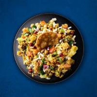 Puffed Rice Chaat · A delicious mixture of puffed rice, savory gram flour sprinkles, tomato, onion, and sweet-so...