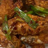 Spicy Chicken Wings With Green Onion · Spicy. Four whole wings, cooked with spicy chili oil and green onions.
