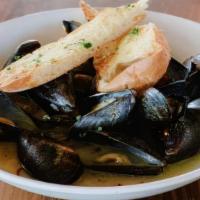 Mussels · Fresh chorizo and garlic tomato broth with herbs