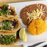 Taco Dinner · Three tacos served with choice of meat. Served with rice and beans.