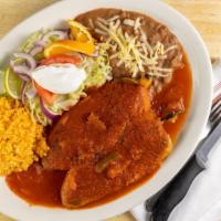 Chile Relleno Dinner · Two poblano peppers stuffed with cheese topped with special red sauce and sour cream. Served...