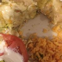Enchiladas Suizas · Three enchiladas filled with choice of meat topped with suiza sauce and melted cheese. Serve...