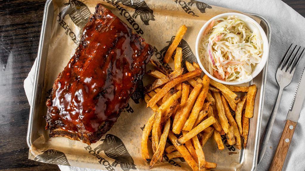 Baby Back Ribs (Full Slab) · Comes with pickle, slaw garnish & a slice of bread.