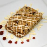 Raspberry Almond Bar · Crumbly, buttery almond bar with raspberry filling and topped with white chocolate.