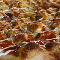 The Flying Buffalo · Pizza Cheese, Roasted Chicken, Red Onion, Buffalo Sauce, Homemade Ranch.