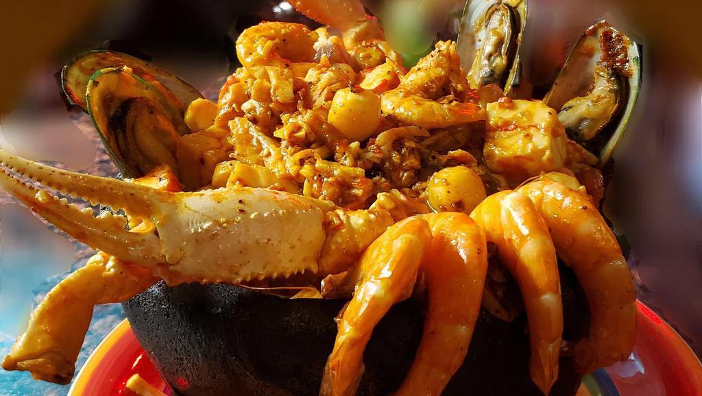 Sea Food Molcajete De Mariscos · Boiling Stone molcajete with octopus, fish, crab legs, mussels, imit crab meat, scallops and shrimp in our delicious Amada's seasoning & huichol sauce.