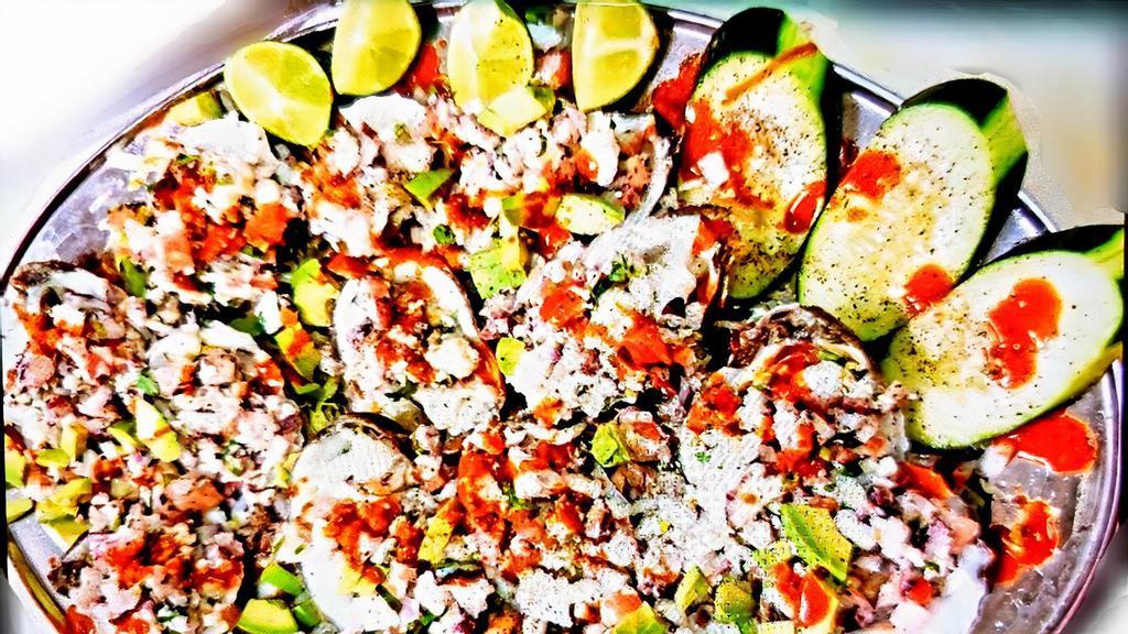 Ostiones Preparados · Especially prepared OYSTERS. Topped with a mix of octopus, shrimp cucumber, tomatoes, onions and avocado., salt and lime.