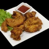 Ck Wings - Garlic · Our lightly breaded house fried chicken wings with garlic sauce.  (Qty 7)