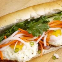 Banh Mi Op La  (Eggs) · Baguette with sunny side up eggs, pickled carrots/daikon, cilantro, jalapenos & mayo.