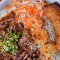 Bun Dac Biet · Grill Shrimp, Pork & Eggrolls with rice noodles, lettuce, cucumbers, bean sprouts, pickled c...