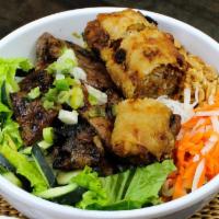 Bun Cha Gio Thit Nuong · Grill Pork & Eggrolls with rice noodles, lettuce, cucumbers, bean sprouts, pickled carrots/d...