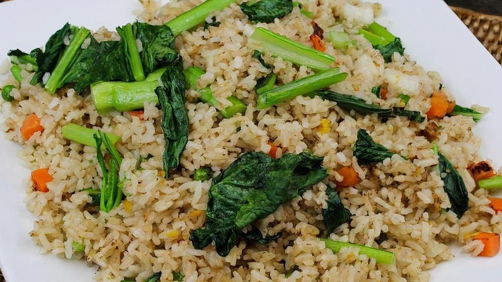 Tofu Fried Rice · Fried rice with chinese greens (Yu Chow), carrots, peas, onions & eggs