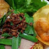 Mi Kho · Egg Noodles  served with shrimp, sliced pork, fried chicken and a crispy shrimp wonton with ...