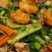 Combo Mi Xao · Beef, Chicken & Shrimp stir fry with cabbage, bok choy, carrots & onions in a savory dark sa...