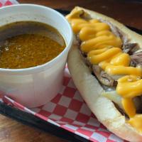 The Philly Beef · Thin Sliced Seasoned Beef Griddled with Onions, Peppers and Mushrooms. Finished with Cheese ...