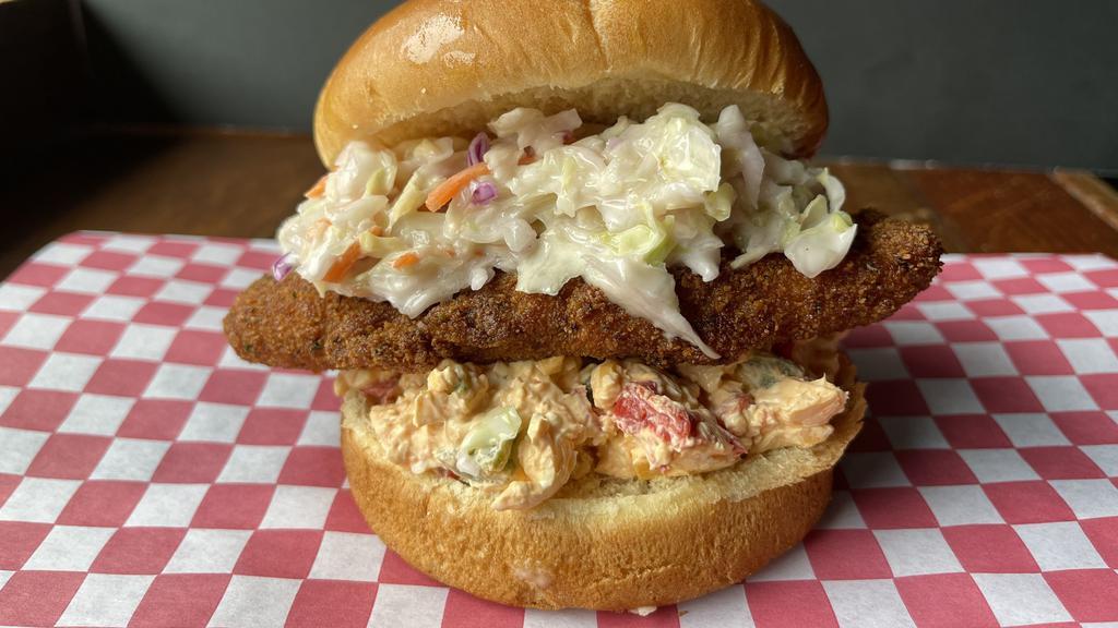 Southern Yardbird · House Battered and Fried Chicken Breast with Pimento Cheese and Creamy Cole Slaw. Served on a Toasted Brioche Bun