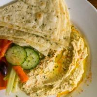 Hummus · Veggies, olives, smoked paprika, olive oil, grilled flatbread
