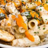 Chicken Alfredo · Rigatoni noodles tossed with alfredo, grilled chicken and asparagus. Drizzled with roasted r...