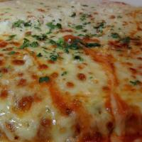 *Chicken Parmesan · Mozzarella, marinara, and spaghetti.