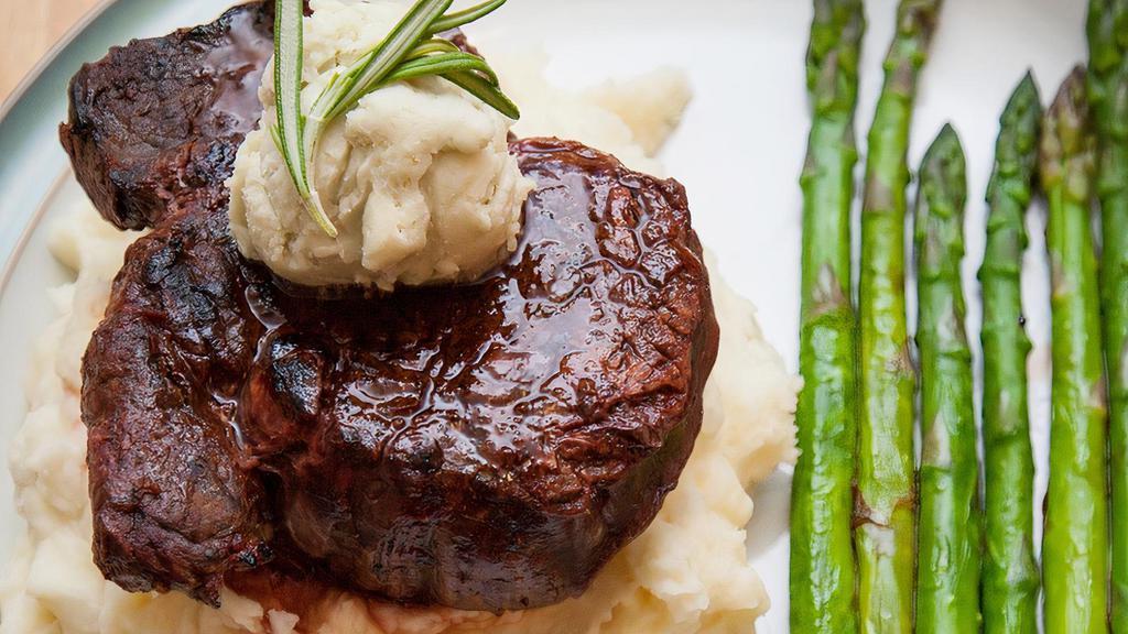*Filet Mignon · 8 oz. hand-cut beef tenderloin cooked to perfection. Served with grilled asparagus and mashed potatoes.
