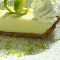 *Key Lime Pie · Florida key lime pie with a graham cracker crust and topped with whipped cream.