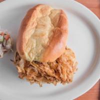 Pulled Pork Sandwich (Combo) · Seven ounces of pulled pork topped with coleslaw and onion straws on a bbq roll.