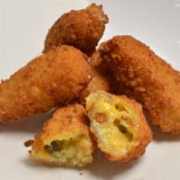 Jalapeño Poppers (5) · Fried and breaded, diced jalapenos with cheddar cheese.