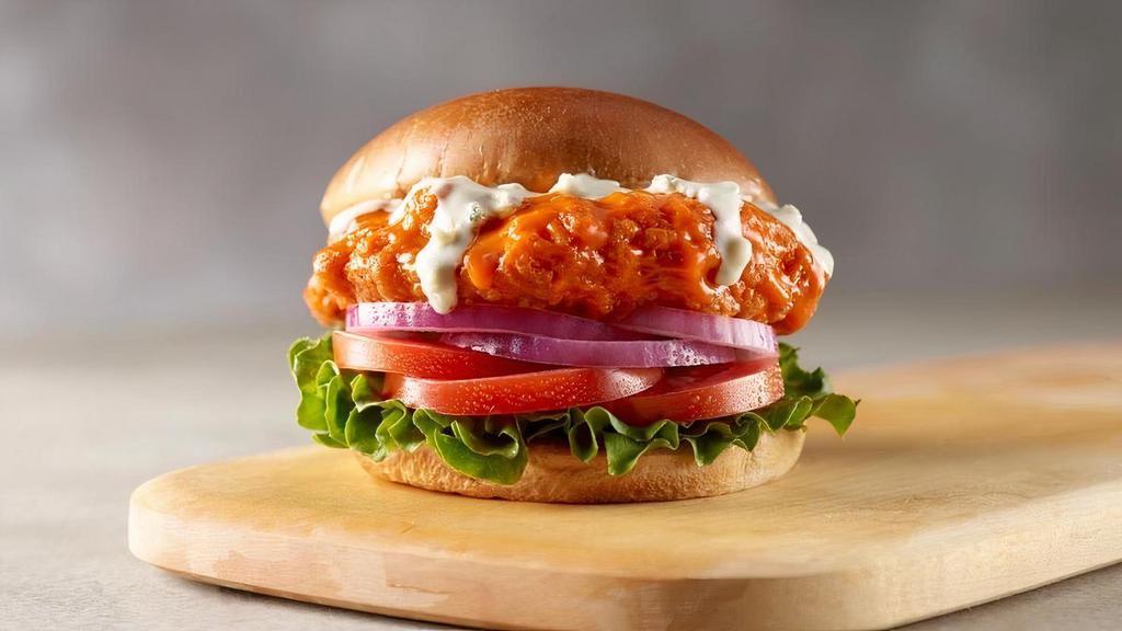 Crispy Buffalo Chicken Sandwich · Southern style breaded chicken breast, tossed in buffalo sauce, topped with chunky blue blue cheese dressing and garnished with lettuce, tomato, and onion. Served with your choice of 1 side.