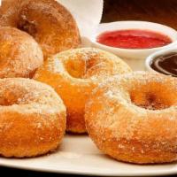 Bag O'Donuts · Fresh, fluffy, round, cinnamon-sugary donuts, chocolate and raspberry dipping sauces.