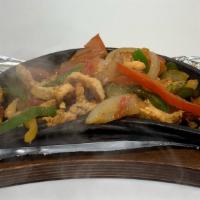 Fajita Lunch · Tender sliced steak or chicken grilled with bell peppers onions, and tomatoes. Served with r...