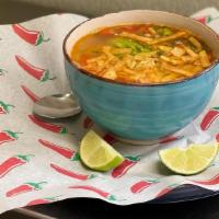 House Soup · Chicken broth with shredded chicken crispy tortilla strips and pico de gallo.