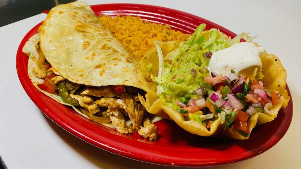 Casa Fajita Quesadilla · A large tortilla stuffed with cheese, chicken, steak and shrimp. Grilled with green peppers, tomatoes and onions. Served with a mini tortilla bowl filled with lettuce, guacamole, sour cream pico de gallo with a side of rice.