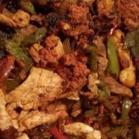Sazon Fajitas · Steak, chicken and shrimp cooked with bell peppers, onions and tomatoes. Includes rice, bean...