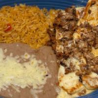 Pollo Con Chorizo · Grilled chicken breast topped with chorizo and white cheese sauce, served with rice, beans a...