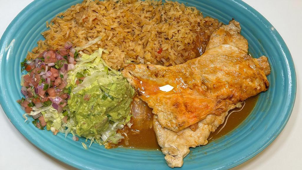 Pollo Loco · Grilled Chicken breast topped with ranchero sauce. Served with rice, lettuce, Pico de gallo and Guacamole with 3 flour tortillas.