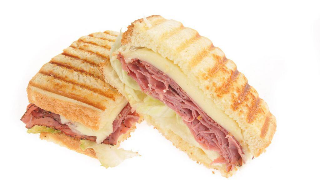 Panini With Turkey And Cheese · Tasty panini filled with delectable turkey and creamy cheese.