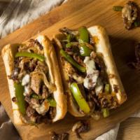 Cheesesteak · Our cheesesteak sandwich is made with crisp lettuce, tomatoes, sautéed onions, and provolone...